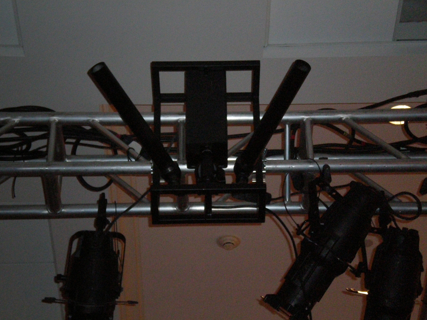 confetti cannons hanging on truss